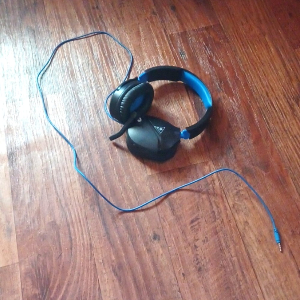 A pair of blue and black turtle beach headphones